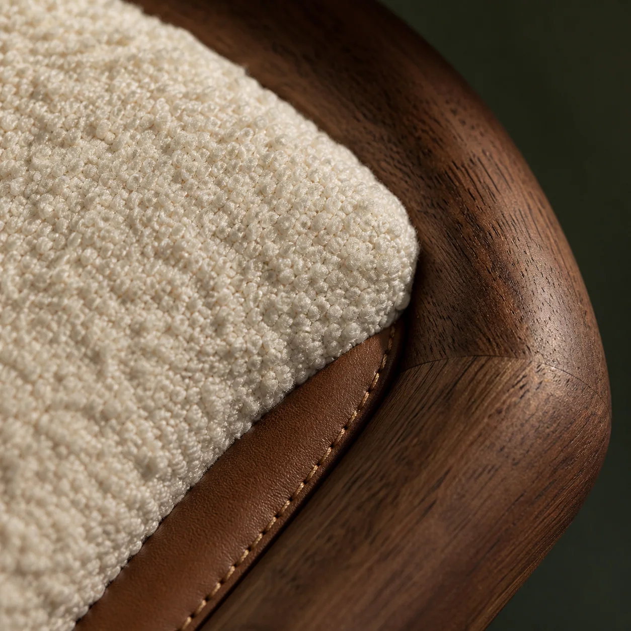 Aro stool detail in walnut, leather and bouclé